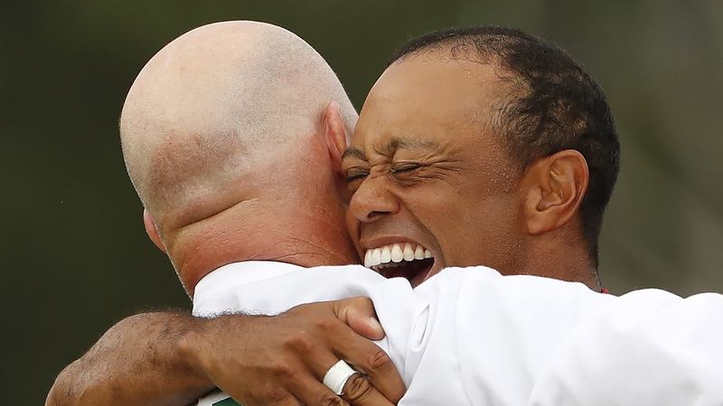 Woods celebrates with caddie Joe LaCava