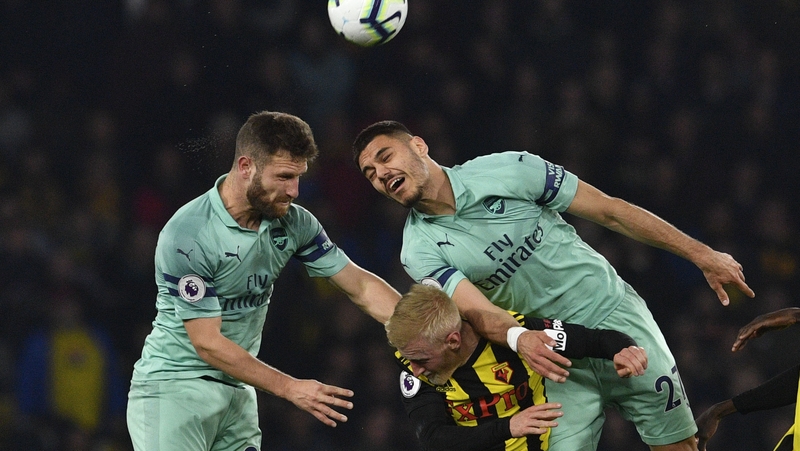 Arsenal's Shkodran Mustaf and Konstantinos get the better of Watford's Will Hughes