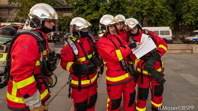 A handout photo made available by the Brigade de Sapeurs-Pompiers de Paris shows French firefighters in operation