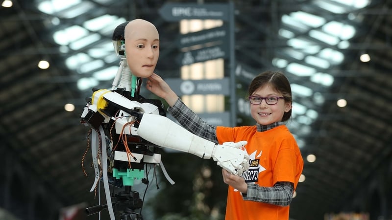 Emma Mullins, age 9 from the Dun Laoghaire CoderDojo pictured greeting "KC" the Robot at the launch of Coolest Projects International