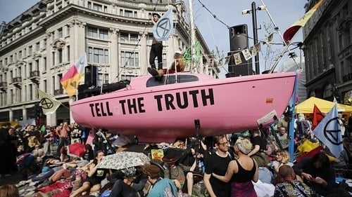 Climate change activists from the Extinction Rebellion group block the road junction at London's Oxford Circus in April 2019
