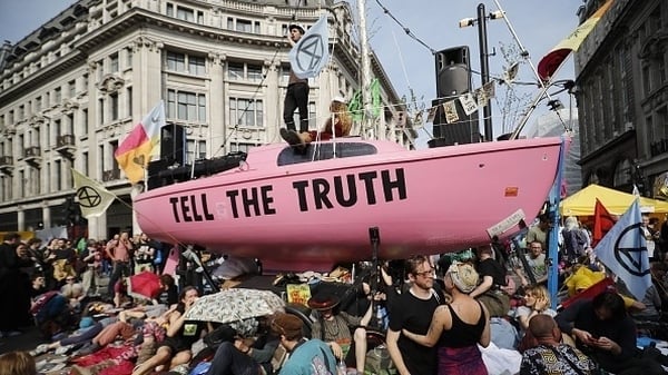 Climate change activists from the Extinction Rebellion group block the road junction at London's Oxford Circus in April 2019