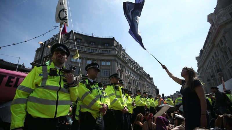 Police surround a pink boat on London's Oxford Street