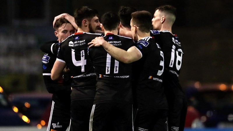 Conor Levingston celebrates scoring a goal with teammates