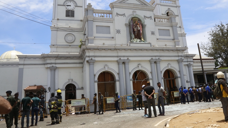 Security personnel stand guard after a explosion hit at St Anthony's Church in Kochchikade in Colombo