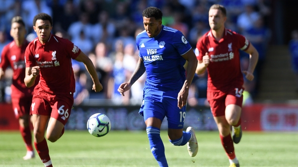 Nathaniel Mendez-Laing of Cardiff City evades Trent Alexander-Arnold and Jordan Henderson