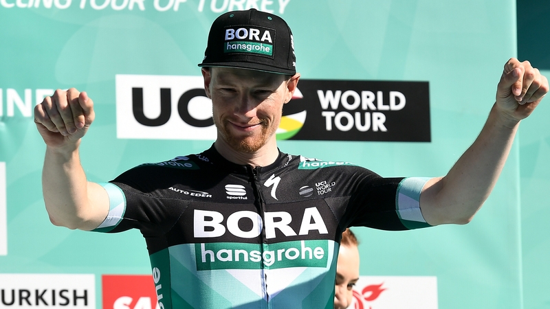 Sam Bennett of Bora-Hansgrohe celebrates on the podium
