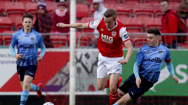 St Patrick's Chris Forrester with Gary O'Neill of UCD