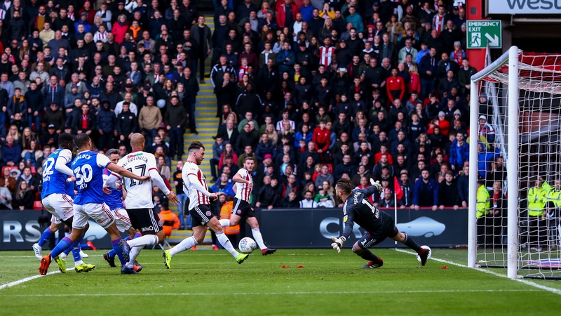 Scott Hogan scored Sheffield United's opener as they effectively assured themselves of promotion against Ipswich Town