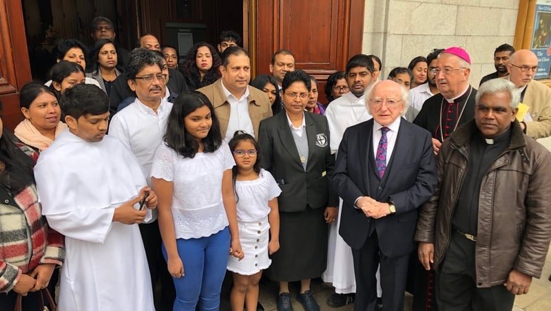 President Michael D Higgins and Archbishop Diarmuid Martin with members of the Sri Lankan community