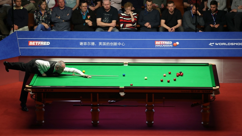 John Higgins at the table