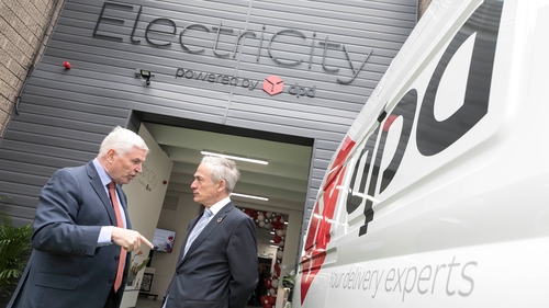 Des Travers, CEO of DPD Ireland and Minister Richard Bruton pictured at the launch of the company's electric fleet