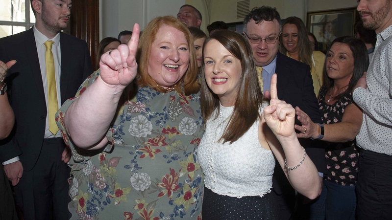Alliance Party leader Naomi Long celebrates with Nuala McAllister(right) on her election at Belfast City Hall