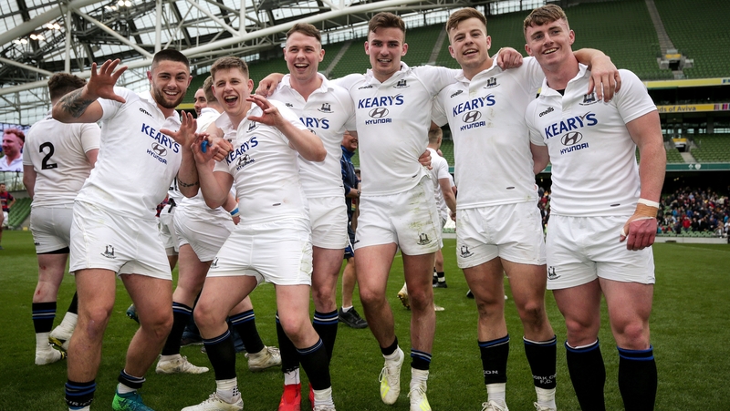 Cork Constitution players celebrate after the final whistle