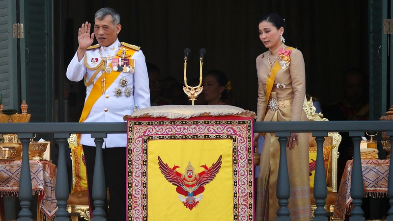 Monarch and new Queen Suthida greet people as the coronation draws to an end