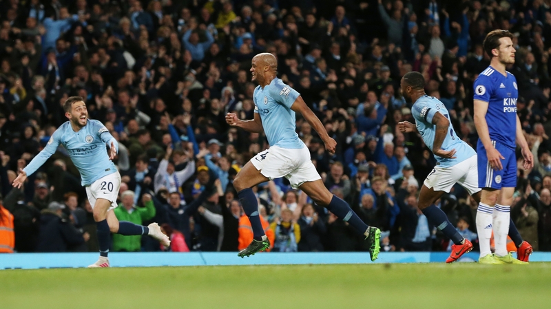 Manchester City's Vincent Kompany (C) celebrates scoring