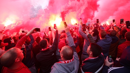 Liverpool have condemned a flag that was hung in the away end at Genk