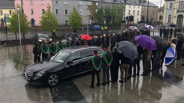 Guard of honour formed as Eugene McGee's remains arrived at St Mel's Church in Longford