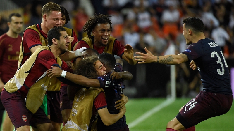 Arsenal's French striker Alexandre Lacazette (C) celebrates with teammates