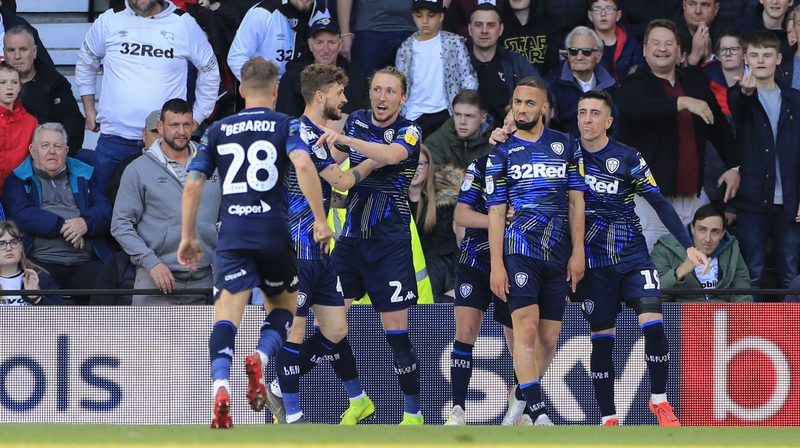 Leeds players celebrate their goal at Derby