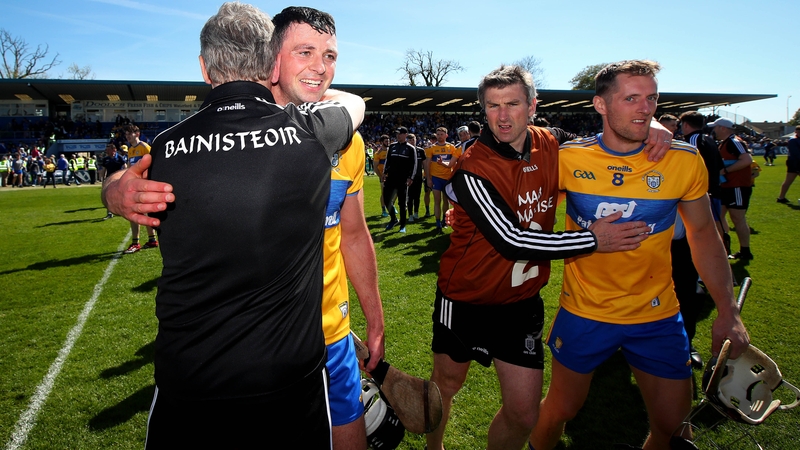 Clare management and players celebrate after beating Waterford