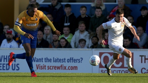 Padraig Amond (R) in action for Newport against Mansfield