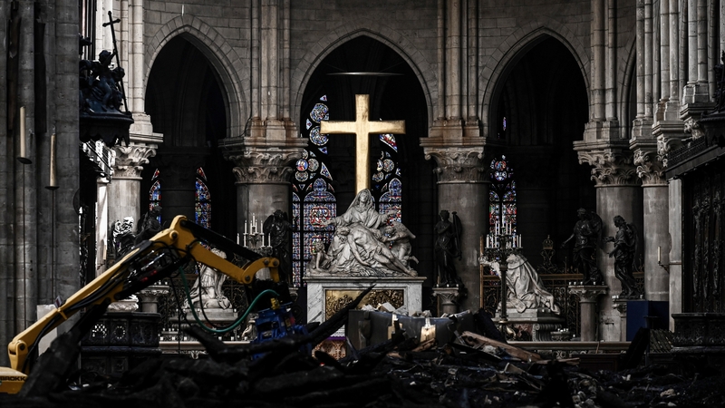 Rubble and the cross at the altar inside Notre-Dame Cathedral, one month after it sustained major fire damage