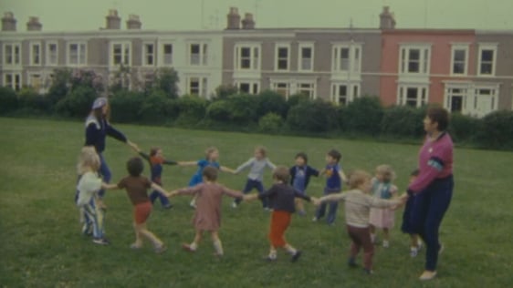Children and teachers of Monkstown Naíonra playing in Belgrave Square (1984)