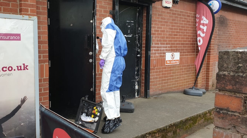 Forensic officers examine the scene in east Belfast