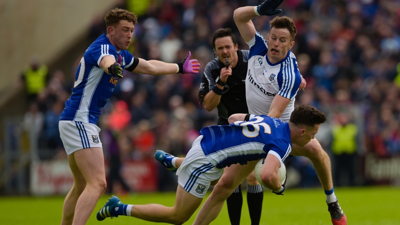 Cavan's Dara McVeety tackled by Fintan Kelly of Monaghan during the 2017 quarter-final clash between the sides