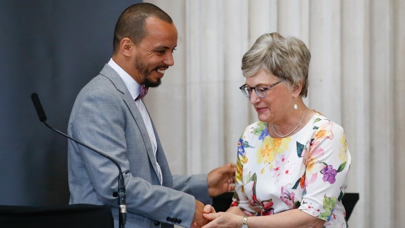 Minister Zappone presents gay rights activist Badr Baabou with his Frontline Defenders award