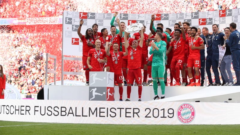 Franck Ribery of Bayern Munich lifts the trophy