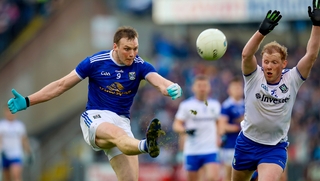Cavan's Gearoid McKiernan with Paudie McKenna of Monaghan
