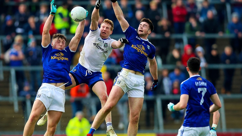 Cavan's Conor Brady and Thomas Galligan with Kieran Hughes of Monaghan