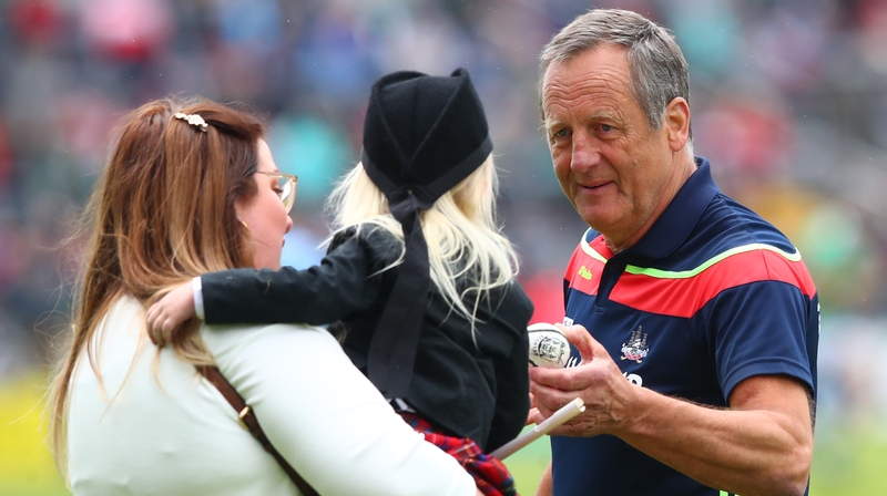 Meyler gives a little child a sliotar before throw-in at the LIT Gaelic Grounds