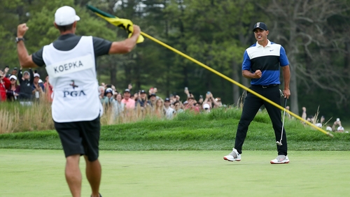 Ricky Elliott celebrates as Koepka made the winning putt on 18 at Bethpage Black