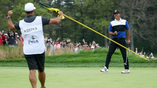 Ricky Elliott celebrates as Koepka made the winning putt on 18 at Bethpage Black