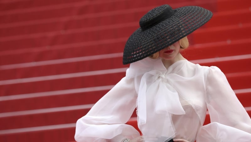 The look was finished with a hat by Philip Treacy.