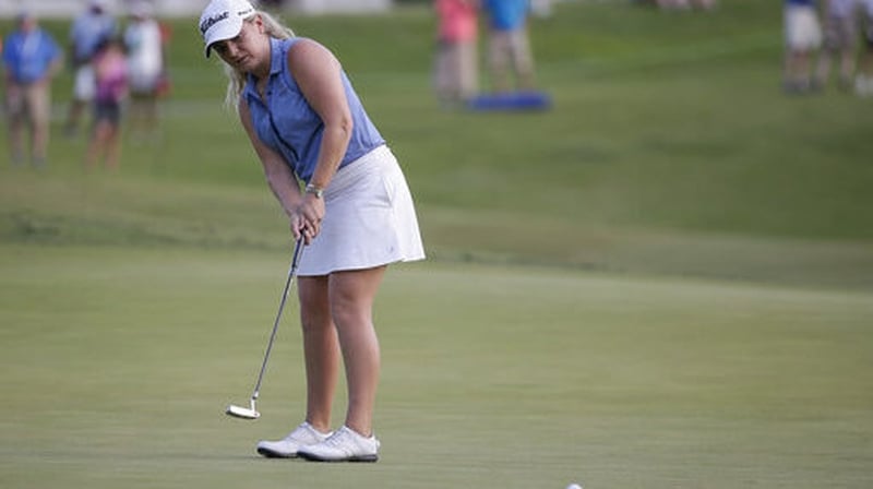 Bronte Law putts on the 18th hole for victory