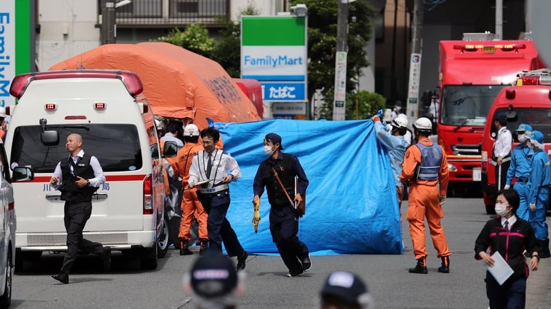 Emergency personnel attend the scene