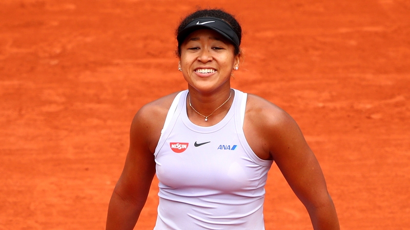 Naomi Osaka celebrates her win over Victoria Azarenka