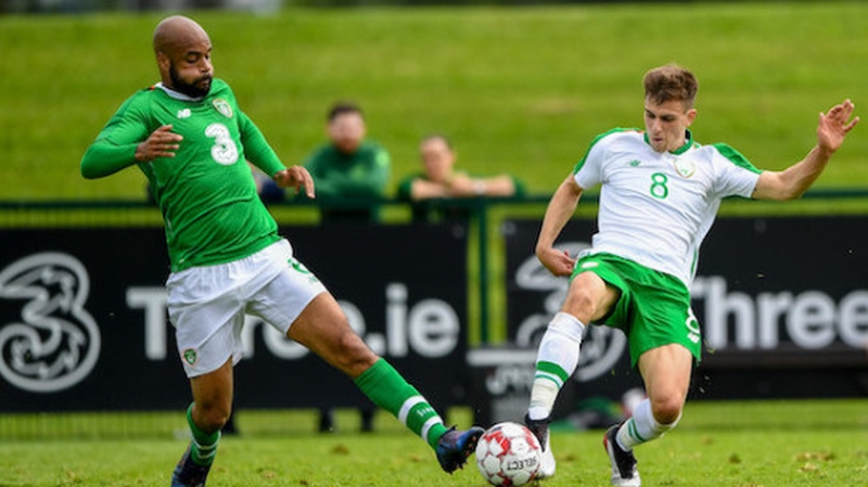 Republic of Ireland striker David McGoldrick in action against Jayson Molumby of Republic of Ireland U21s