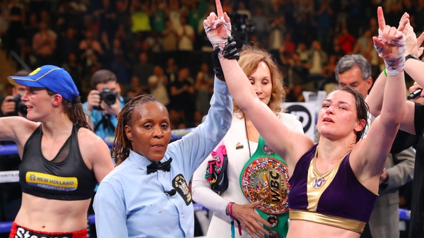Katie Taylor celebrates winning the majority points decision