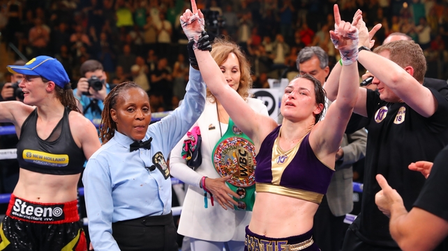 Katie Taylor has her hand raised as the undisputed lightweight champion of the world