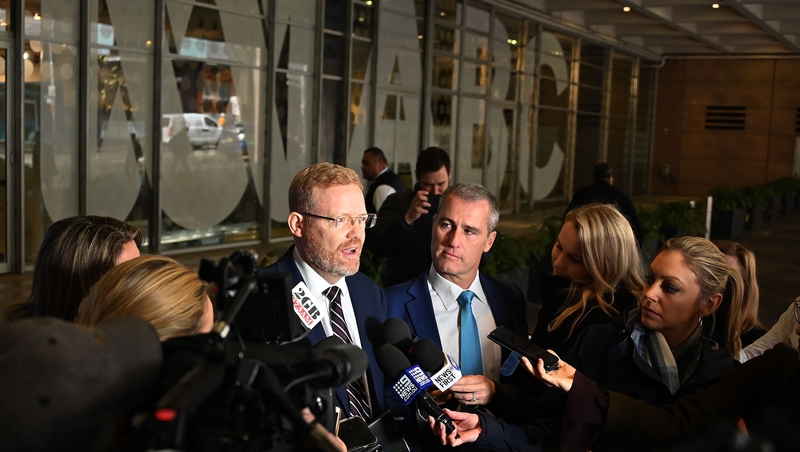 ABC's editorial director Craig McMurtrie speaks to the media after the police raid
