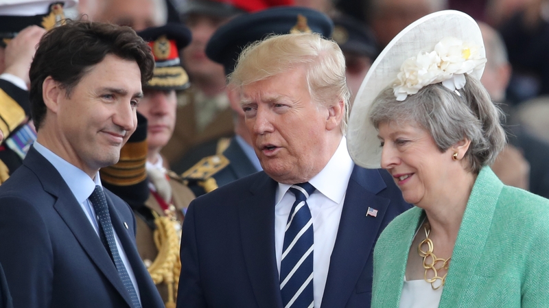 President Trump joined Canada's Justin Trudeau (L) and British Prime Minister Theresa May in Portsmouth today