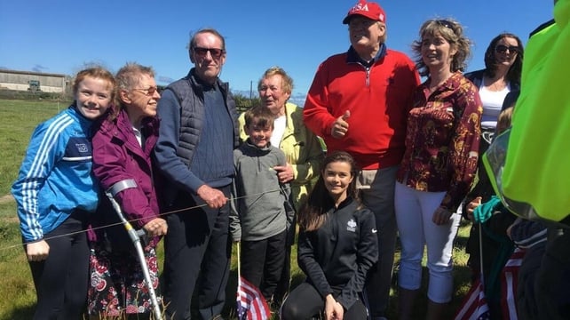 On an 'unofficial' visit to Ireland the president stopped for photos with local children while playing golf at his course in Doonbeg