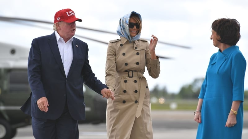 Ms Rose Hynes, Chairman of the Shannon Group (R) with Mr and Mrs Trump as they arrive at Shannon Airport before their departure for the US