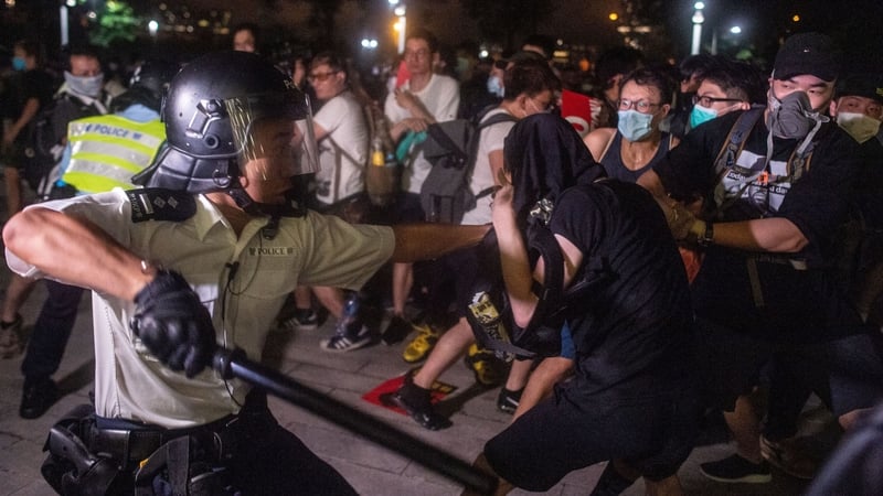 The violence began after police moved to clear protesters