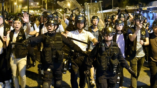 Police face-off against protesters during clashes after a rally against amendments to the extradition bill